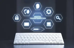 Keyboard with icons of different technology connected to Digital Transformation